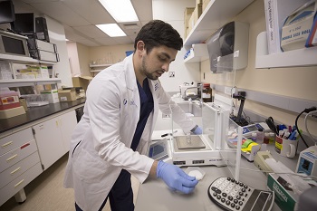 Medical student conducts tests